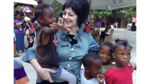 Dr. Michelle Corral with orphans - Chesed International Charity